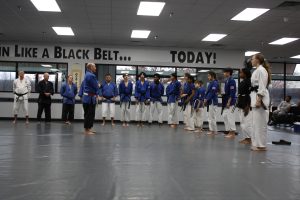 black belts at attention 