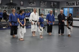 black belts being presented
