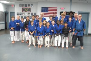 students posing for picture after getting promoted 