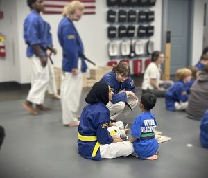 Assistant Instructor helping child