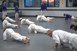 Class doing basic push ups 