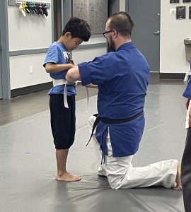 Student Earning their White Belt 