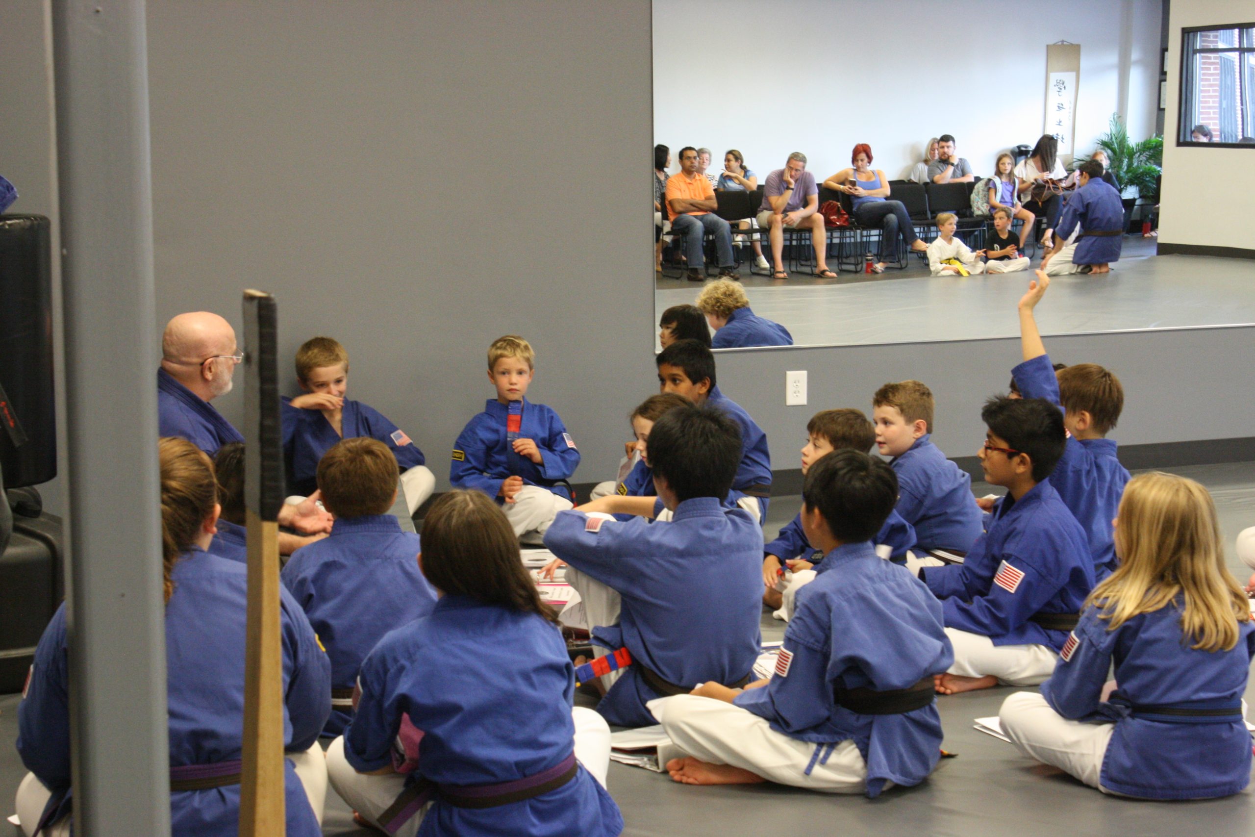 students sitting around a teacher