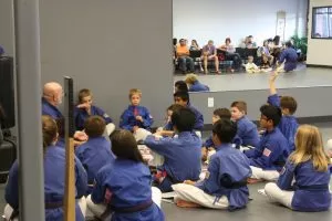 students sitting around a teacher