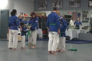 belts being tied upon two parents